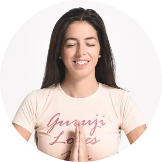 Meditating A smiling female with closed eyes is meditating
