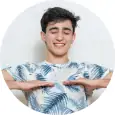 Breathing A smiling male with both his palms facing downwards performing breathing exercise